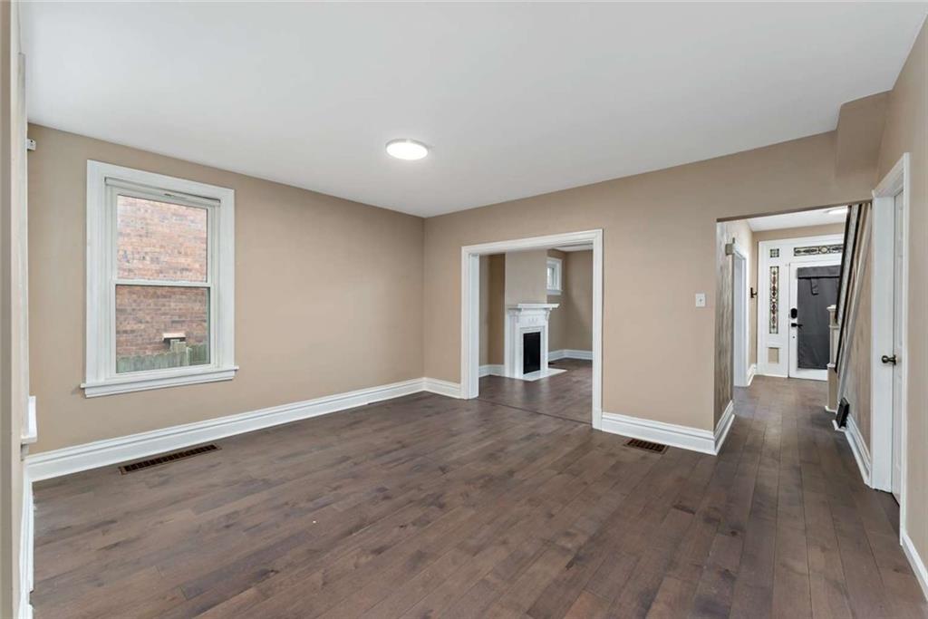 2002 Hampton Street Pittsburgh, PA 15218 - Photo 6 of 21 a view of a livingroom with wooden floor and a window