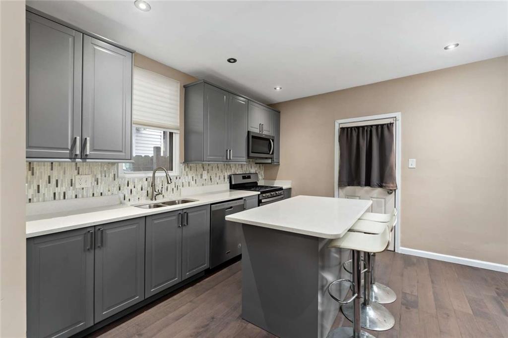2002 Hampton Street Pittsburgh, PA 15218 - Photo 7 of 21 a kitchen with a sink cabinets and wooden floor