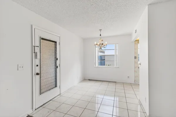 a kitchen with stainless steel appliances granite countertop white cabinets stove a sink and dishwasher
