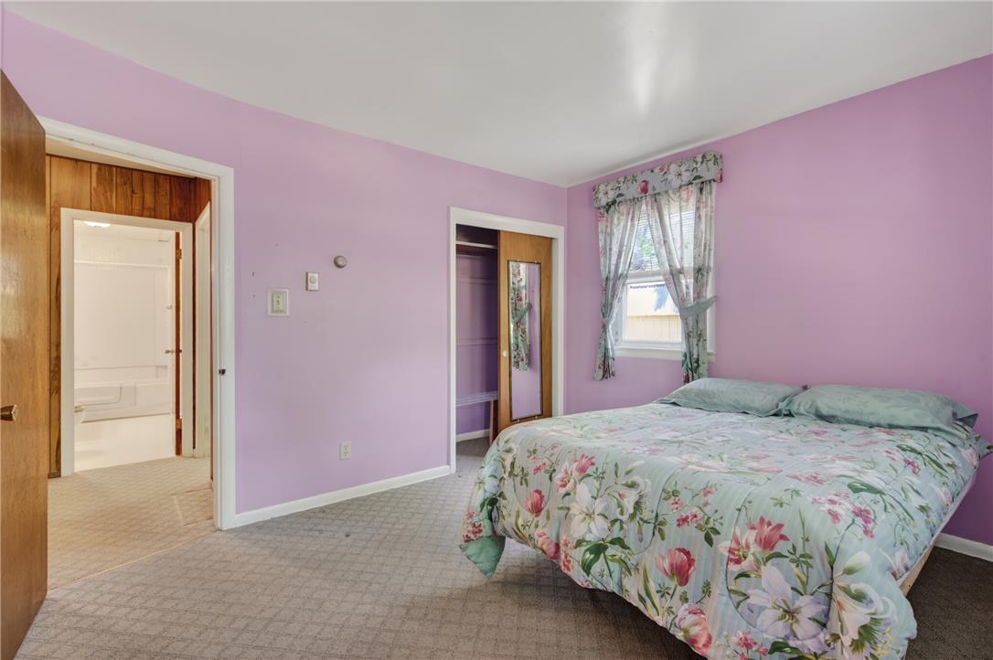 18 White Oak Road Nesquehoning, PA 18240 - Photo 22 of 52 A restful bedroom offers soft purple walls, plush carpet, and a window for natural light.