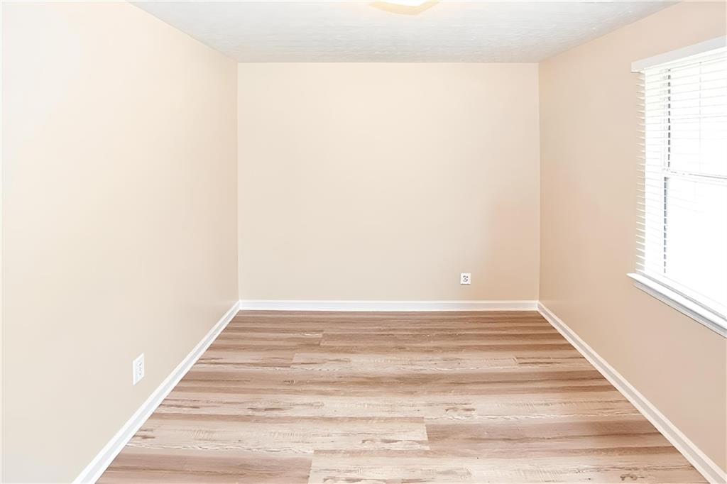 661 Michael Circle Monroe, GA 30655 - Photo 12 of 20 a view of a small space with wooden floor and a window