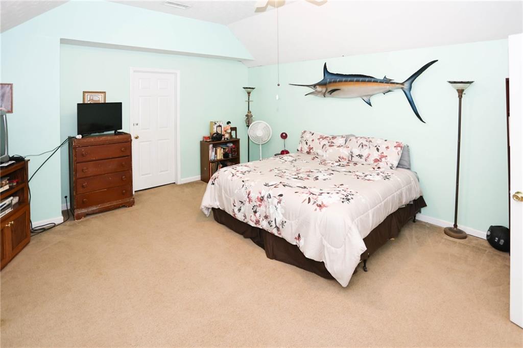 661 Michael Circle Monroe, GA 30655 - Photo 13 of 20 a bedroom with a bed and dresser