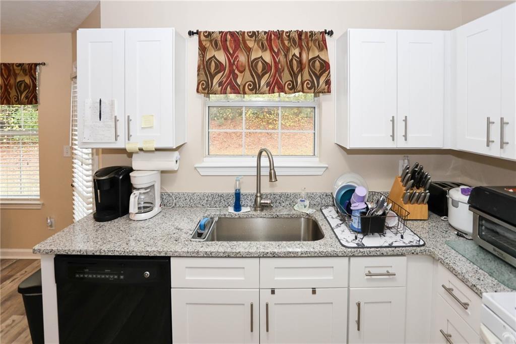 661 Michael Circle Monroe, GA 30655 - Photo 7 of 20 a kitchen with sink and window