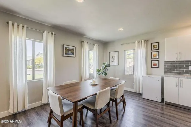a kitchen that has a sink and a stove