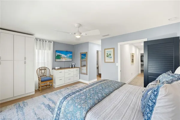 a bedroom with a bed and a chair