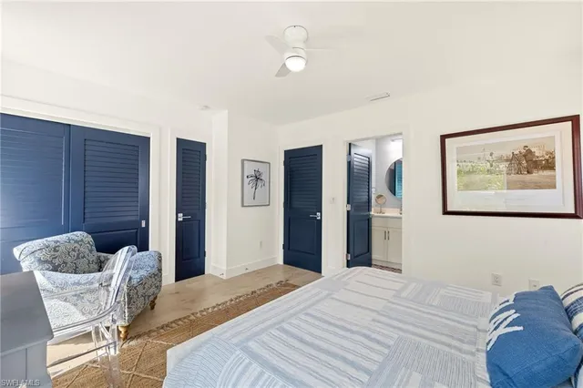 a bedroom with a bed and a chair