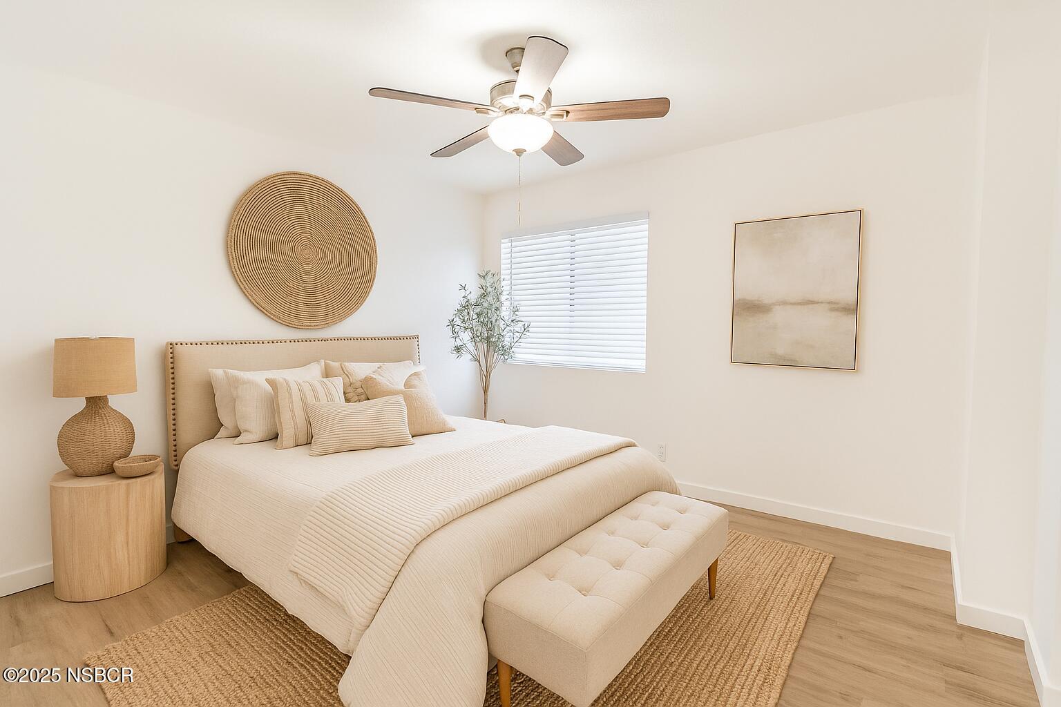 1200 East Walnut Avenue, Unit A Lompoc, CA 93436 - Photo 12 of 23 a bedroom with a bed and a chandelier