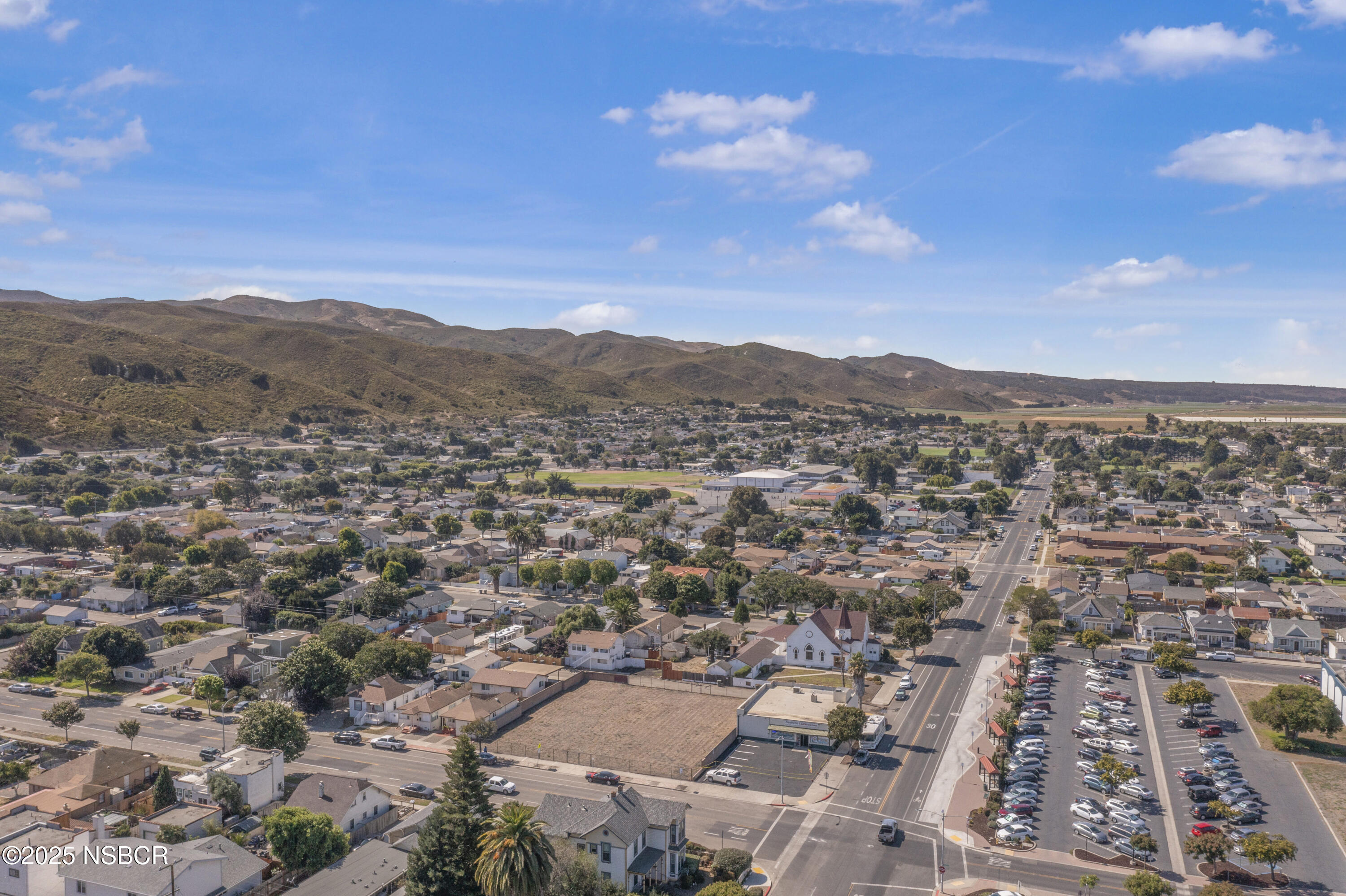 1200 East Walnut Avenue, Unit A Lompoc, CA 93436 - Photo 16 of 23 an aerial view of residential houses with outdoor space and trees