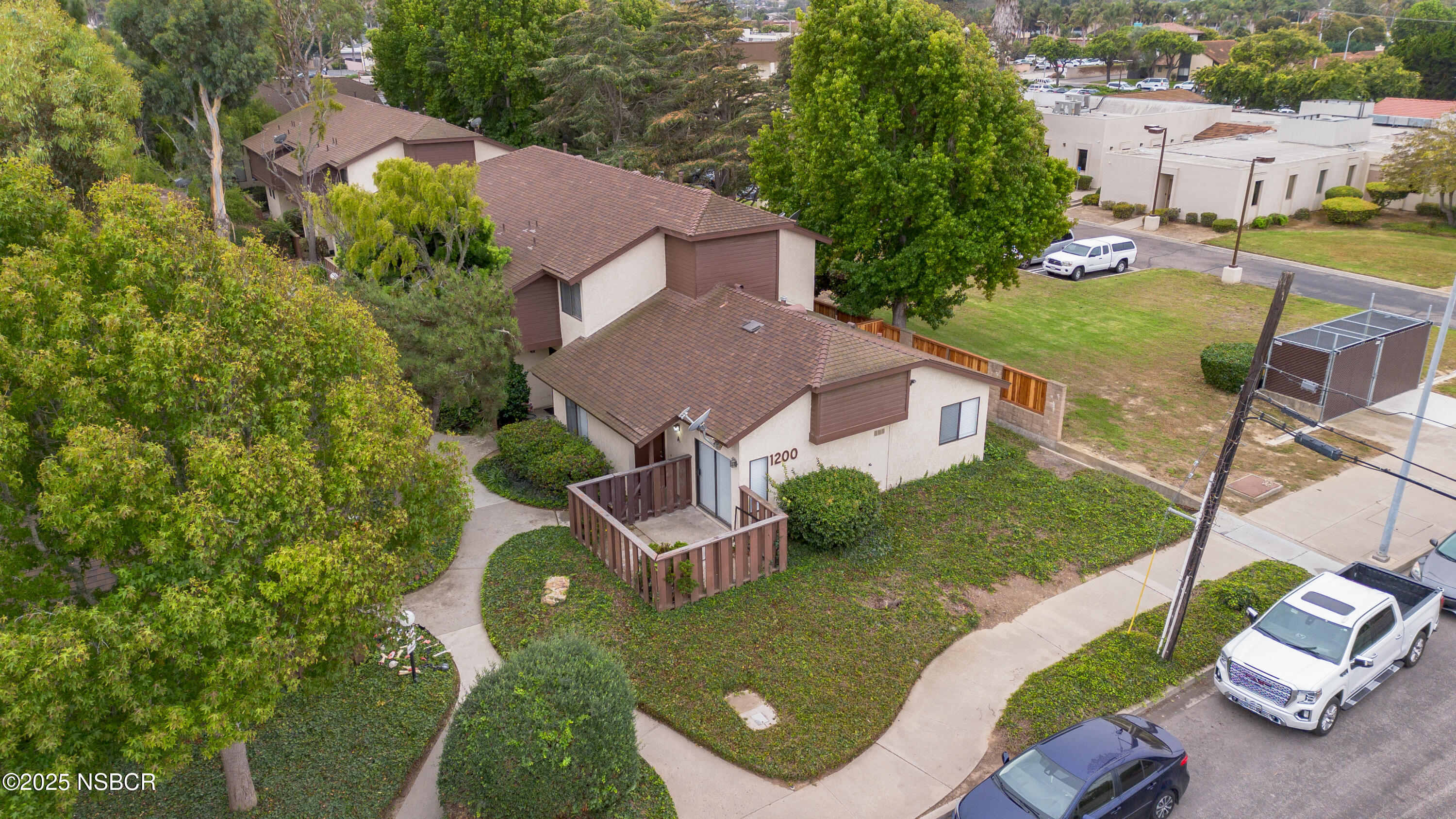 1200 East Walnut Avenue, Unit A Lompoc, CA 93436 - Photo 2 of 23 an aerial view of a house with garden space and street view