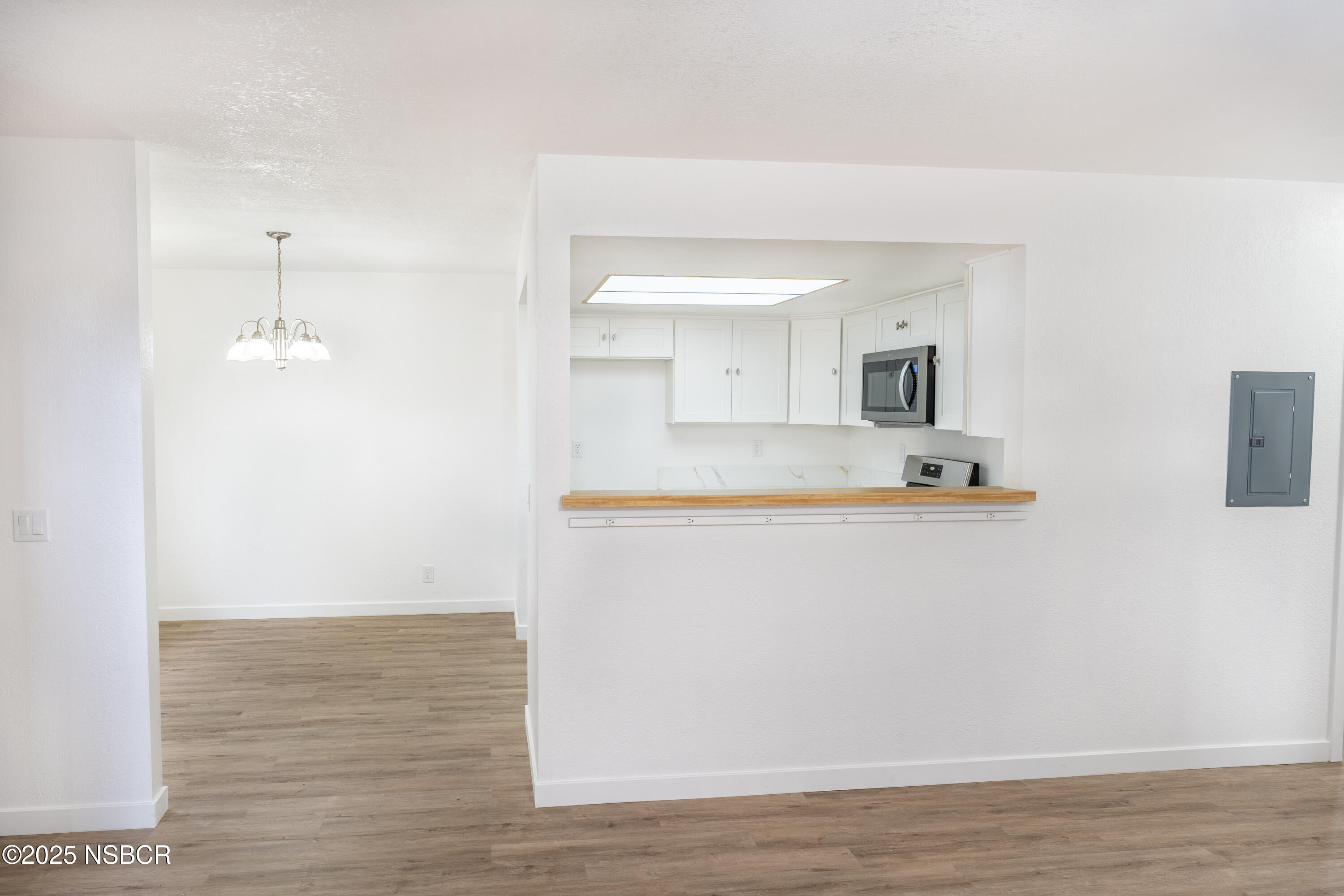 1200 East Walnut Avenue, Unit A Lompoc, CA 93436 - Photo 3 of 23 a view of kitchen with wooden floor