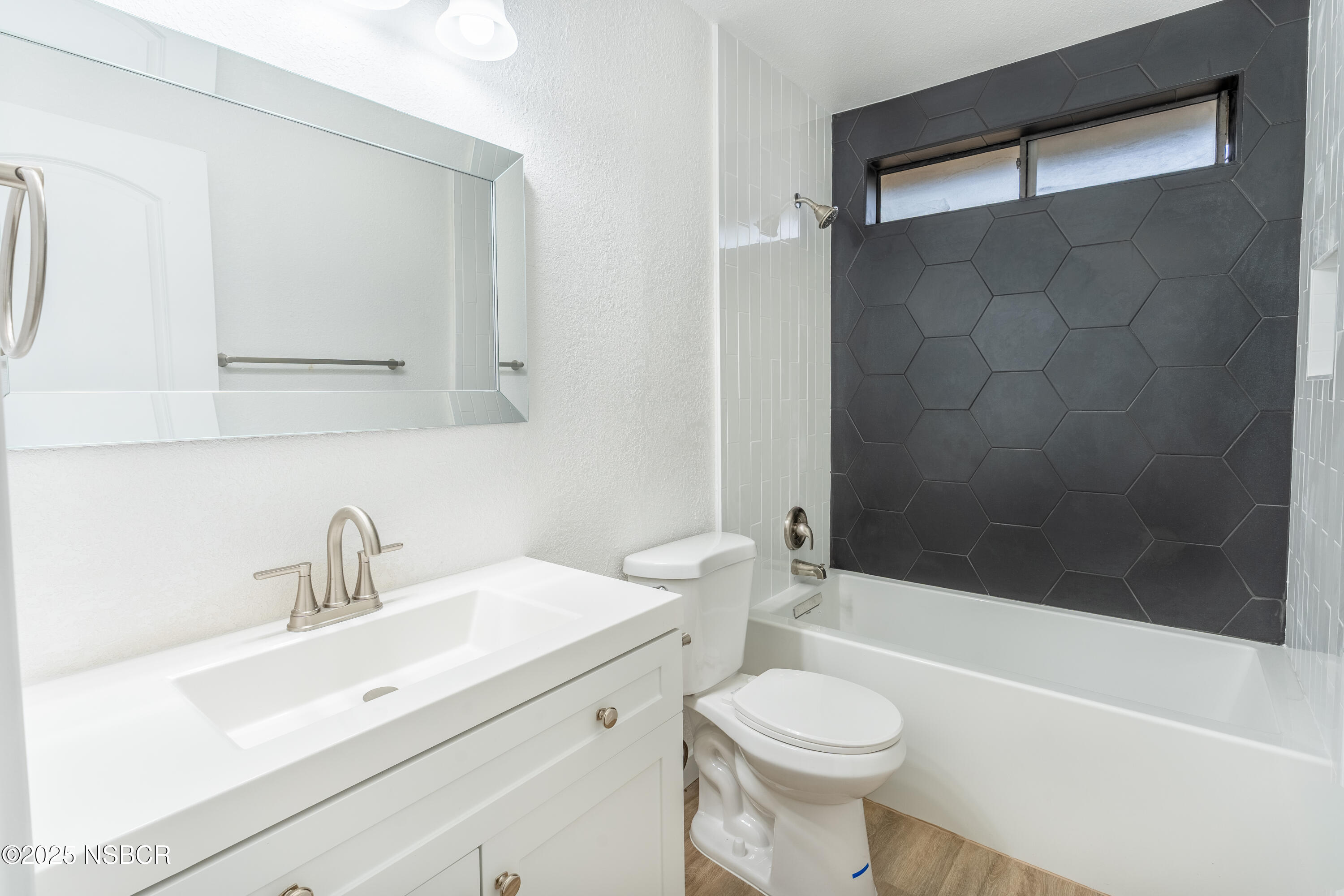 1200 East Walnut Avenue, Unit A Lompoc, CA 93436 - Photo 4 of 23 a bathroom with a sink toilet and shower