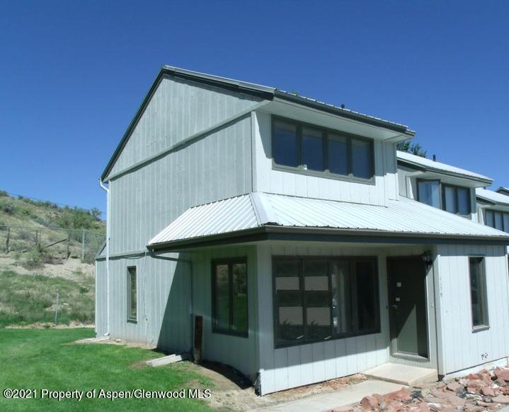1179 Park Avenue Rifle, CO 81650 - Photo 1 of 16 a view of a house with a yard