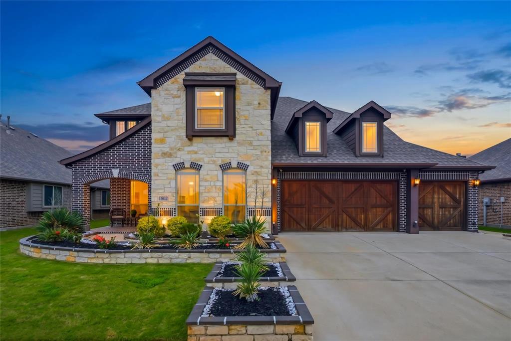 1802 Roundtree Road Forney, TX 75126 - Photo 2 of 39 a front view of a house with a yard