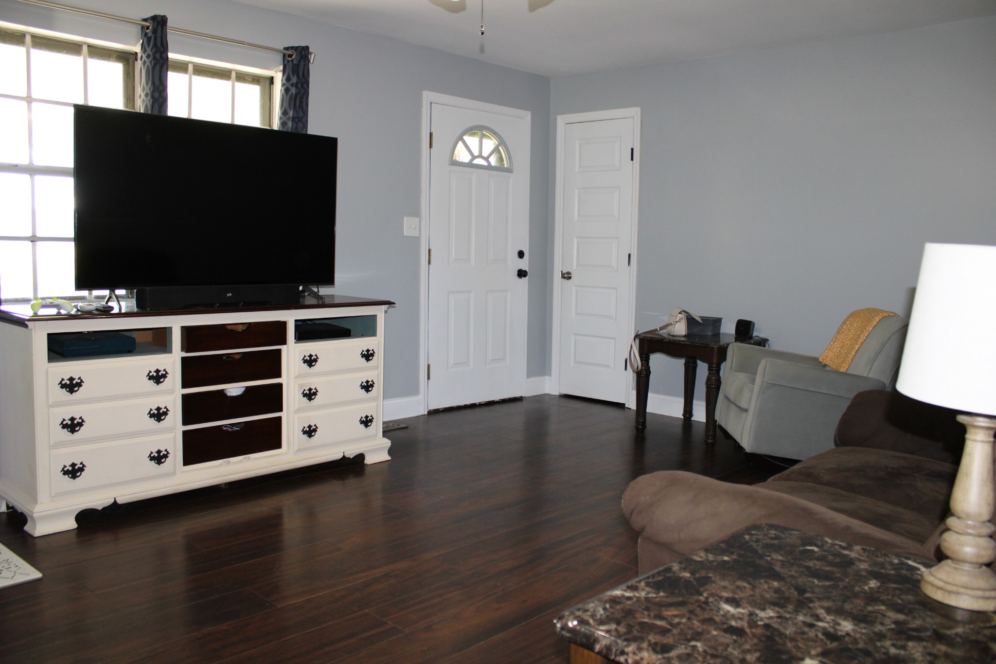 25677 Bethel Road Elkmont, AL 35620 - Photo 7 of 28 a living room with furniture and a flat screen tv