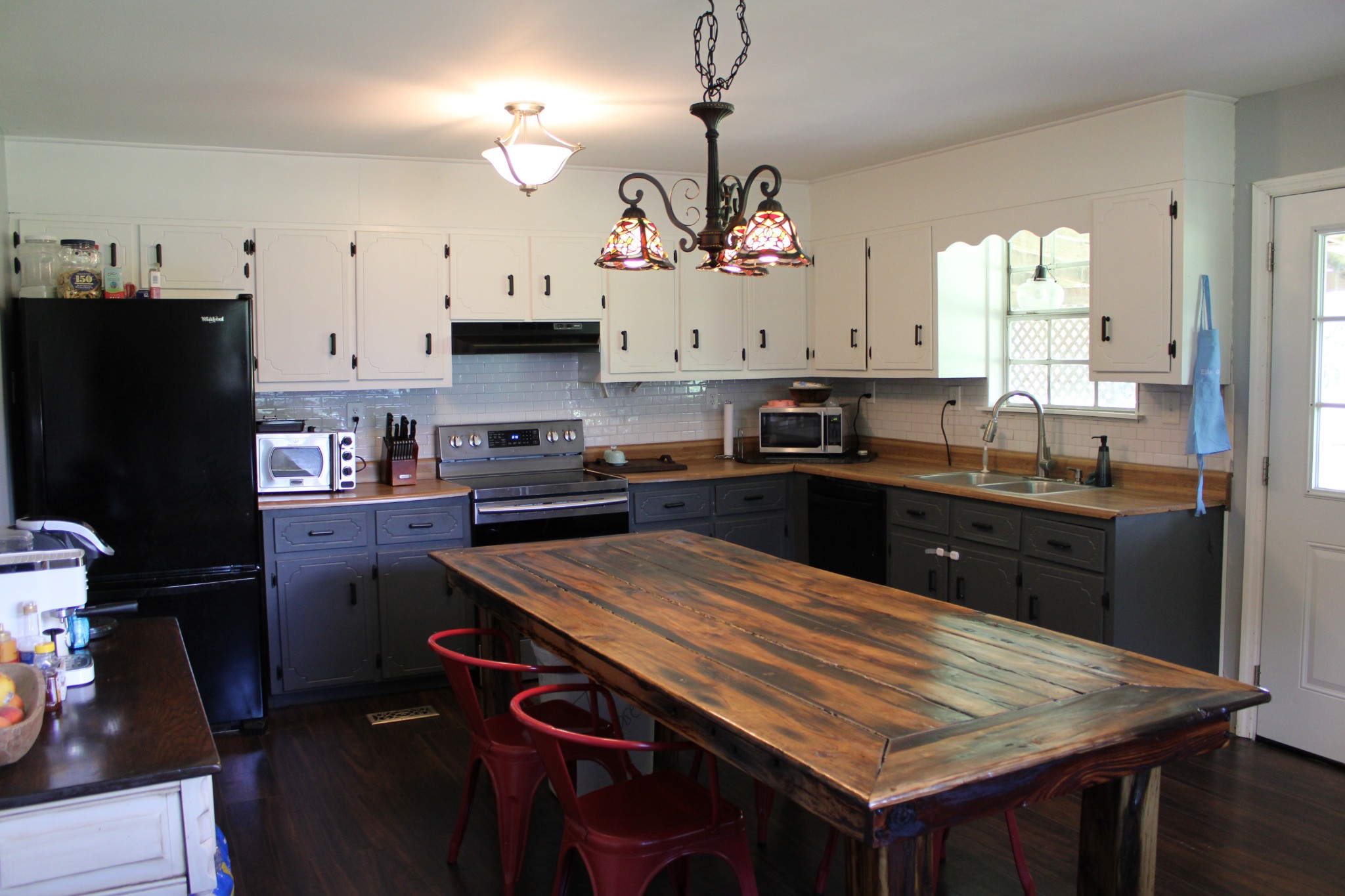 25677 Bethel Road Elkmont, AL 35620 - Photo 8 of 28 a kitchen with a sink a stove a refrigerator and cabinets