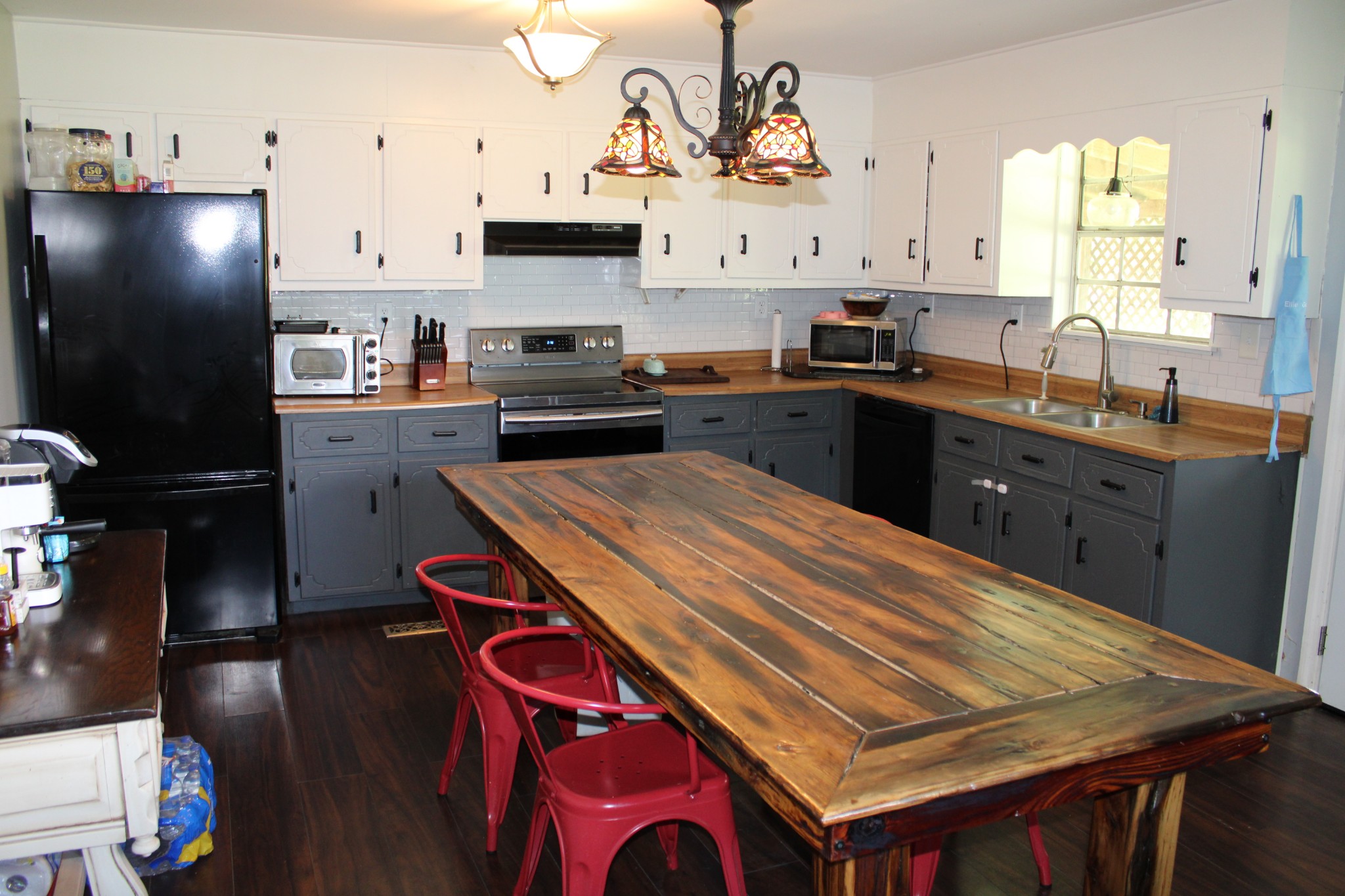 25677 Bethel Road Elkmont, AL 35620 - Photo 10 of 28 a kitchen with stainless steel appliances kitchen island granite countertop a sink a stove and refrigerator