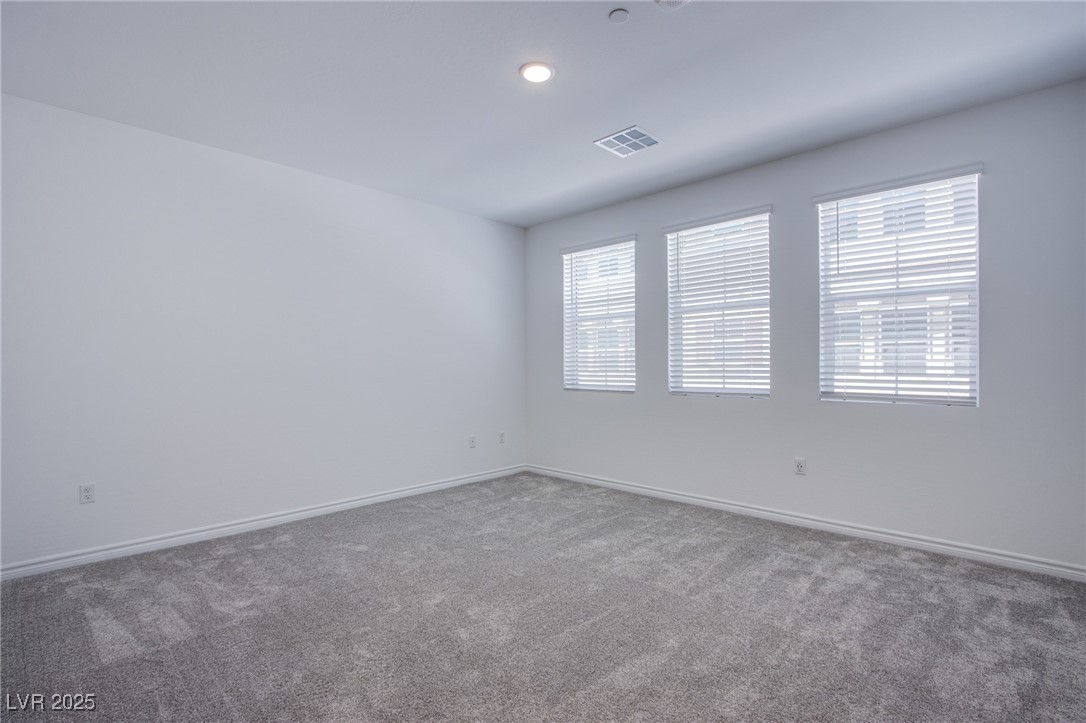 2555 Hampton Road, Unit 11201 Henderson, NV 89052 - Photo 10 of 36 Carpeted spare room featuring baseboards