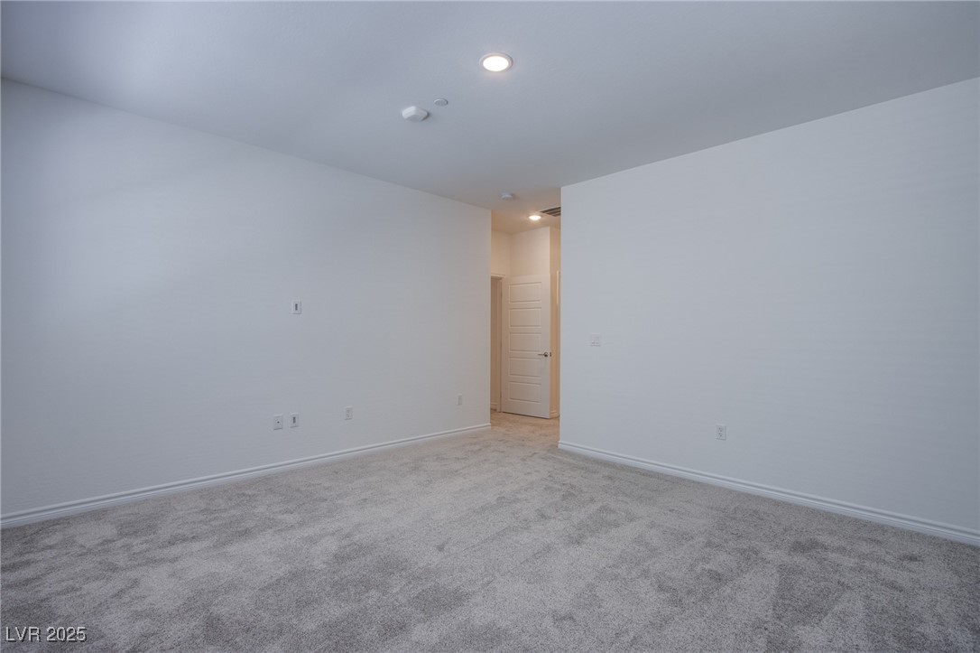 2555 Hampton Road, Unit 11201 Henderson, NV 89052 - Photo 11 of 36 Spare room with light carpet and recessed lighting