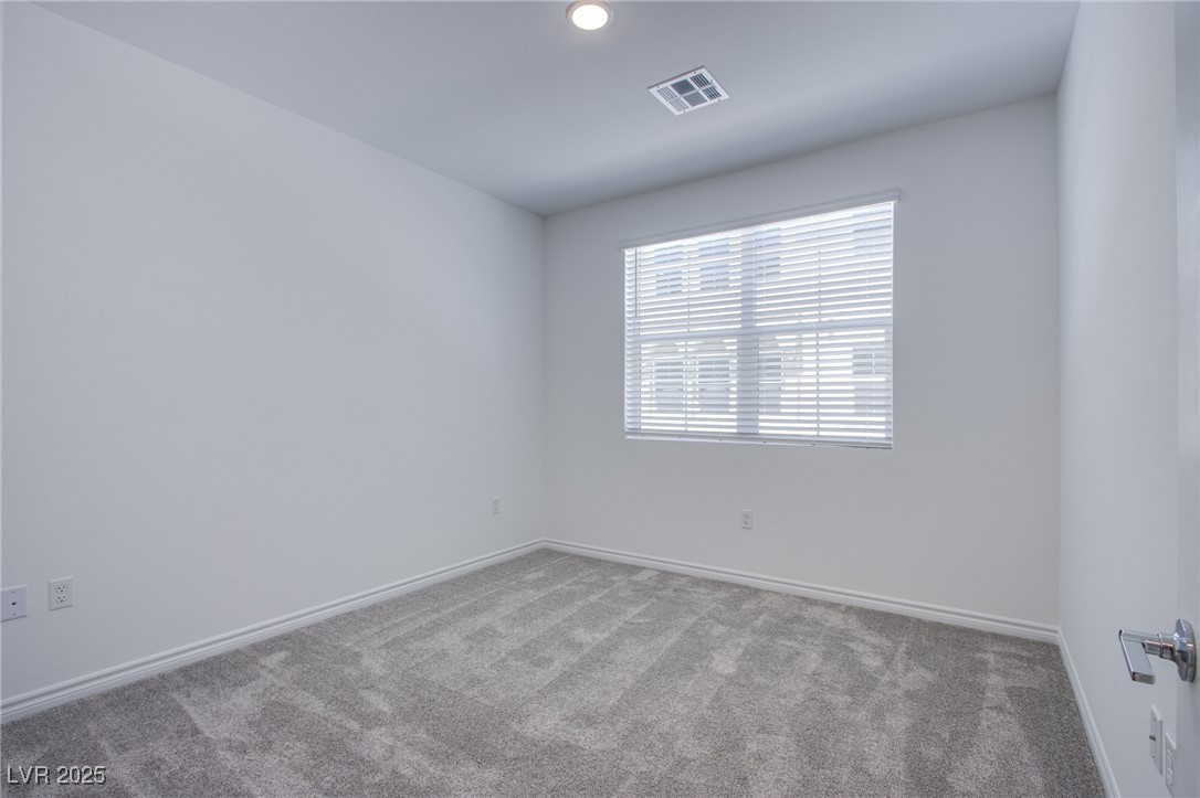 2555 Hampton Road, Unit 11201 Henderson, NV 89052 - Photo 12 of 36 Carpeted empty room with baseboards and recessed lighting