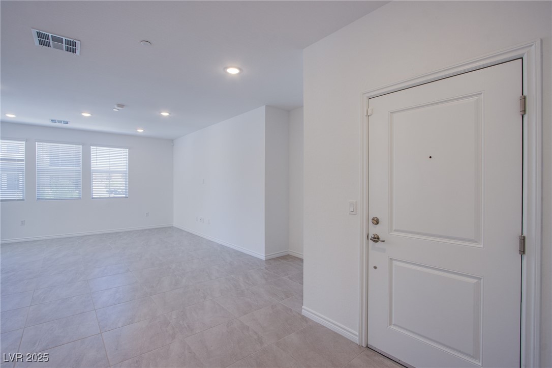 2555 Hampton Road, Unit 11201 Henderson, NV 89052 - Photo 14 of 36 Unfurnished room with recessed lighting and light tile patterned floors
