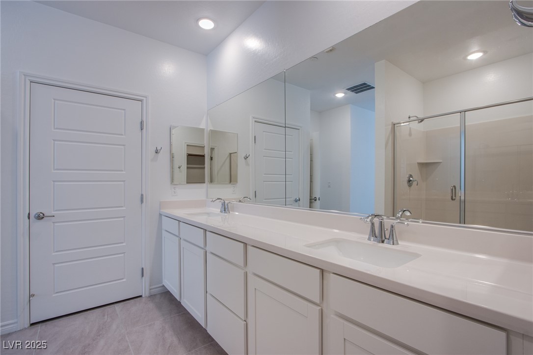 2555 Hampton Road, Unit 11201 Henderson, NV 89052 - Photo 18 of 36 Bathroom featuring a stall shower and double vanity