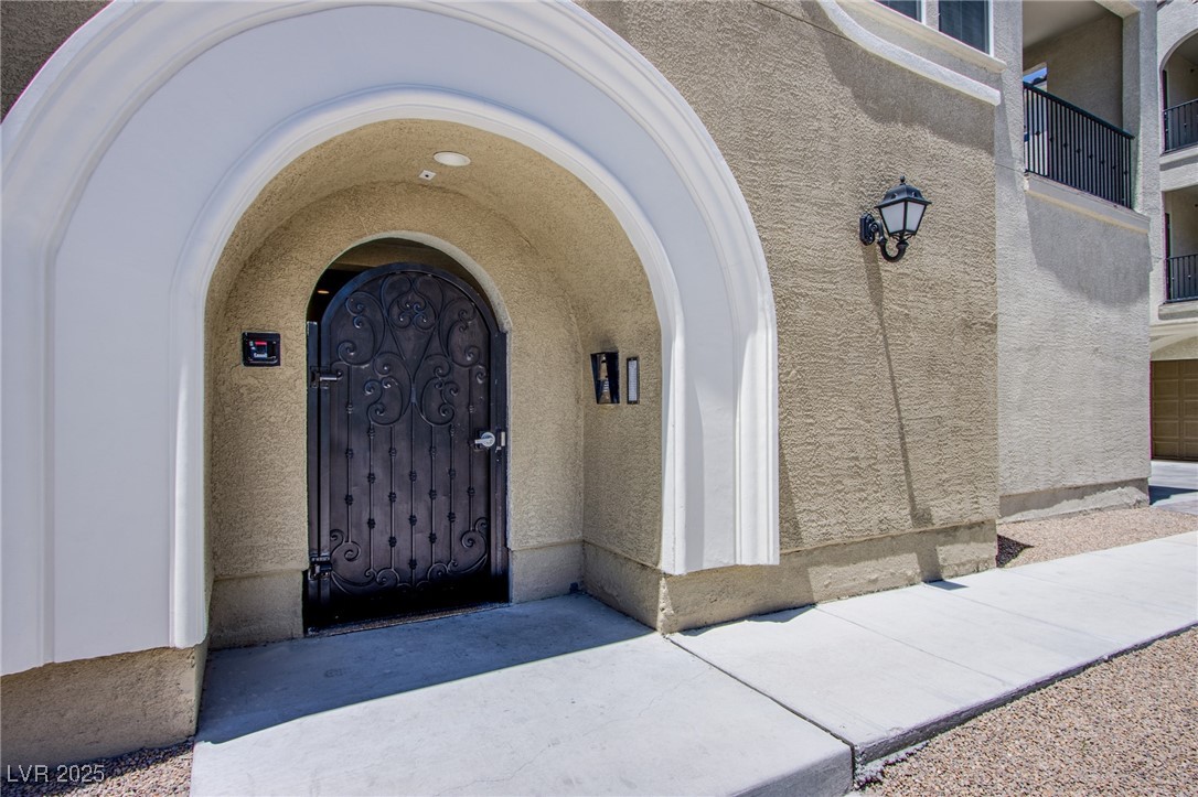 2555 Hampton Road, Unit 11201 Henderson, NV 89052 - Photo 21 of 36 View of exterior entry featuring stucco siding