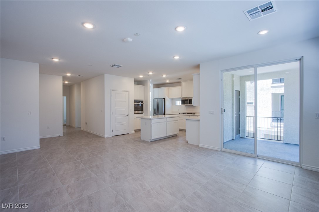 2555 Hampton Road, Unit 11201 Henderson, NV 89052 - Photo 4 of 36 Unfurnished living room featuring recessed lighting and light tile patterned floors