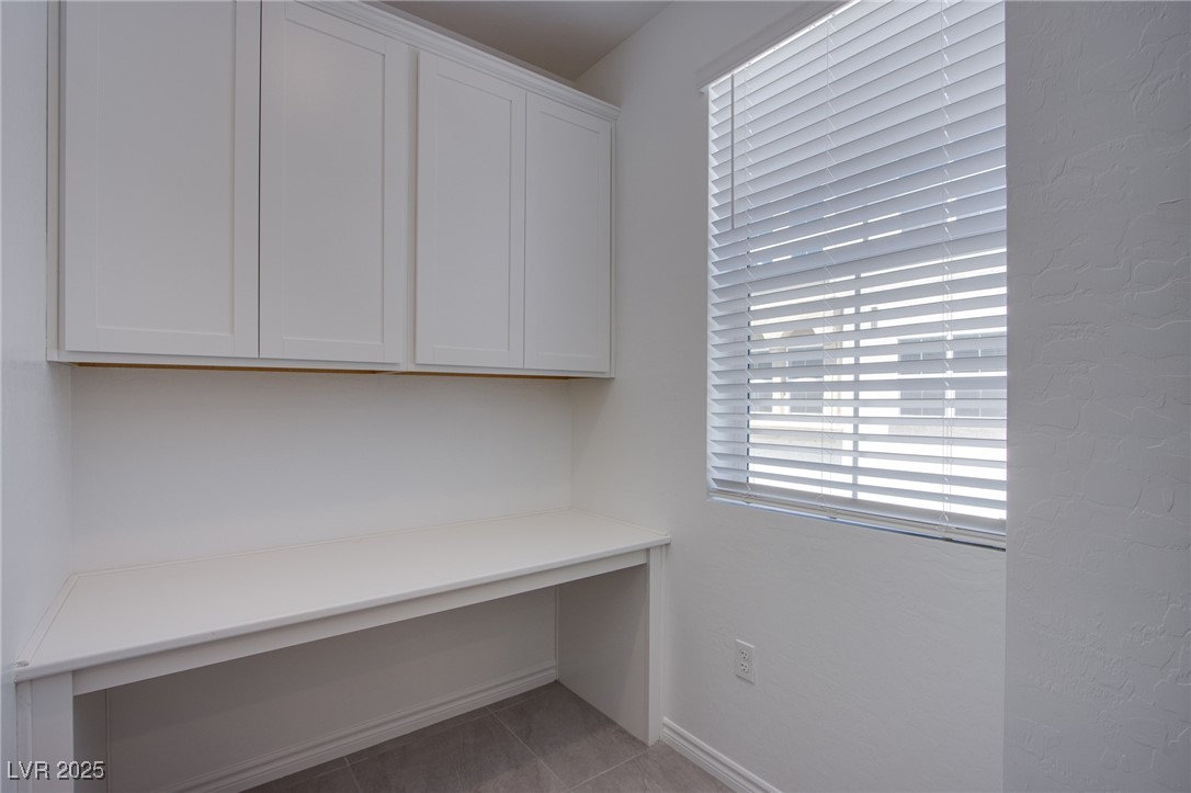 2555 Hampton Road, Unit 11201 Henderson, NV 89052 - Photo 9 of 36 Unfurnished office featuring baseboards and tile patterned flooring