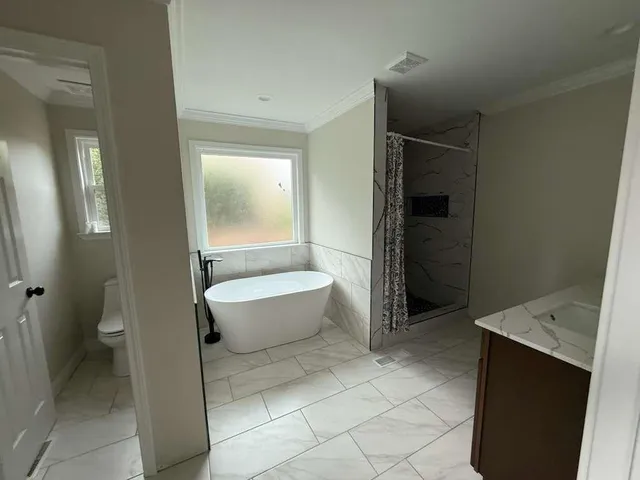 a view of an empty room with a staircase