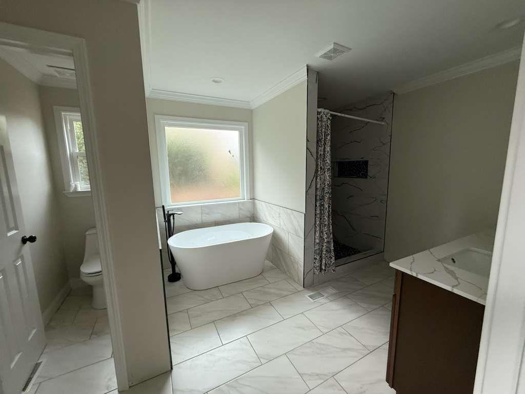 110 Foxfire Drive Warner Robins, GA 31093 - Photo 12 of 27 a bathroom with a toilet and a shower