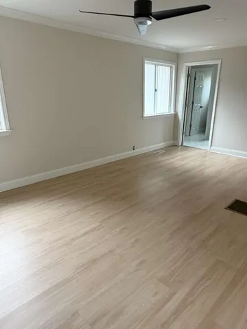 a view of empty room with windows