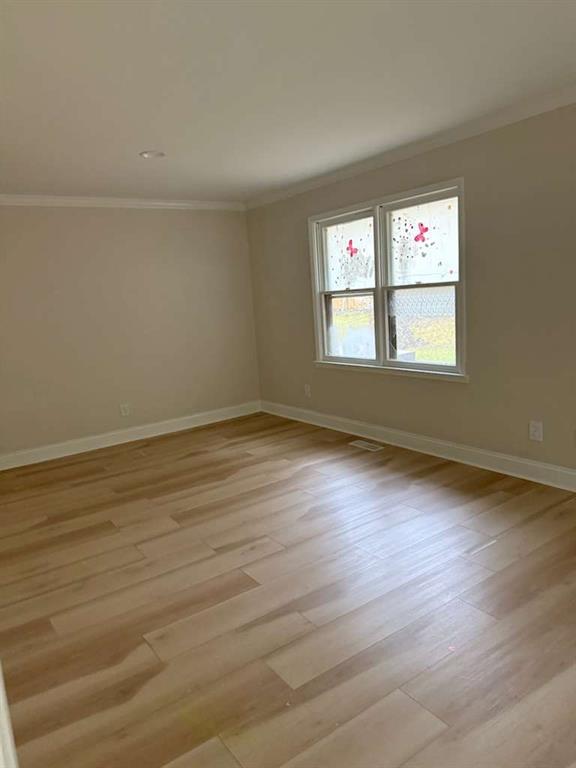 110 Foxfire Drive Warner Robins, GA 31093 - Photo 18 of 27 a view of an empty room with wooden floor and a window