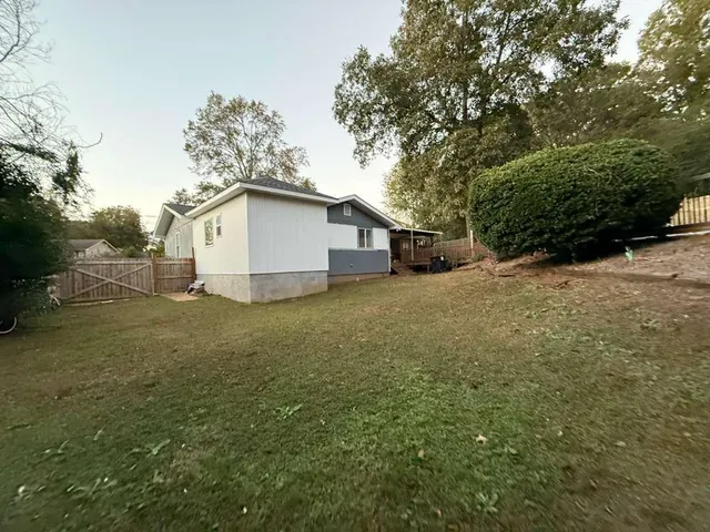 a view of a backyard with a lake view