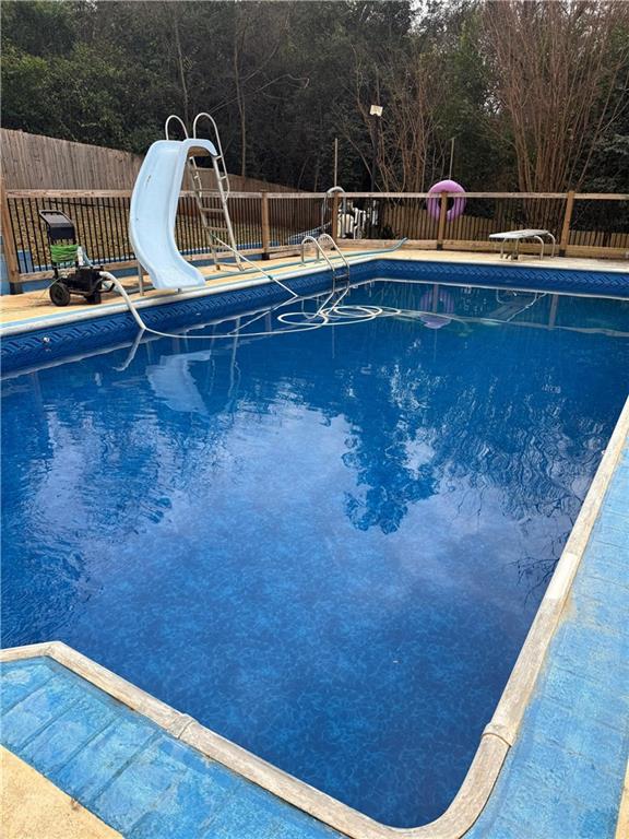 110 Foxfire Drive Warner Robins, GA 31093 - Photo 24 of 27 a wooden bench sitting in a backyard of house