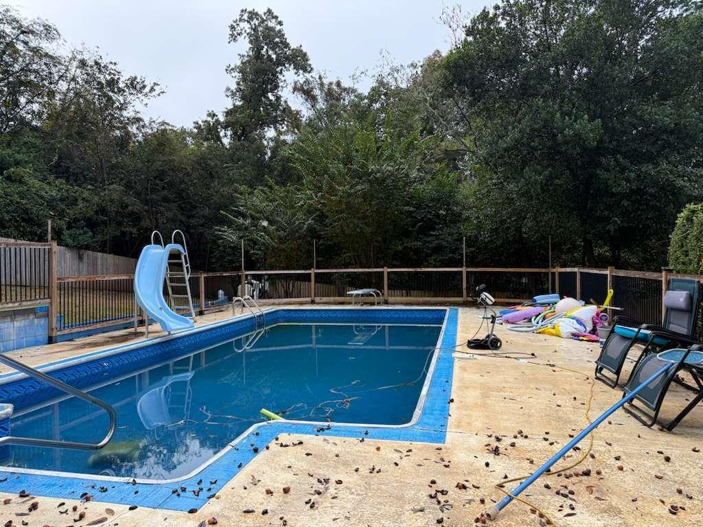 110 Foxfire Drive Warner Robins, GA 31093 - Photo 4 of 27 a view of a swimming pool with a lounge chair