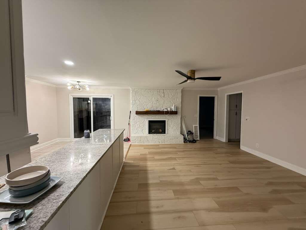 110 Foxfire Drive Warner Robins, GA 31093 - Photo 9 of 27 a view of a kitchen with a sink and a fireplace