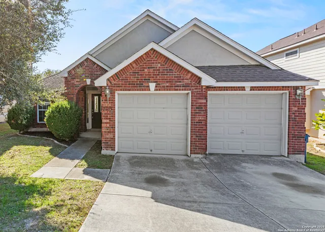 a view of garage and yard