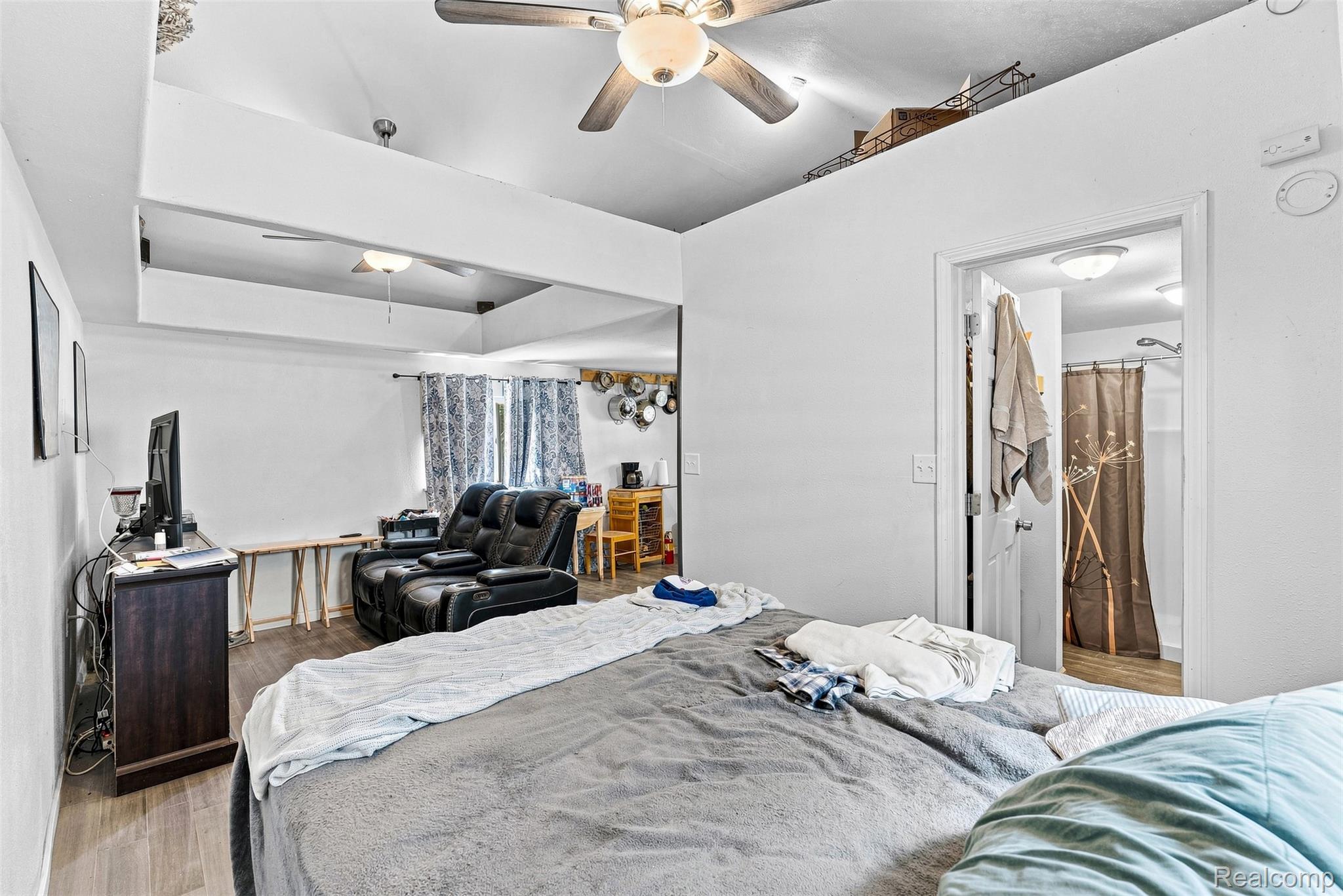 6163 North State Road Davison, MI 48423 - Photo 40 of 45 Vaulted ceiling with exposed beams, recessed lighting, and ceiling fans