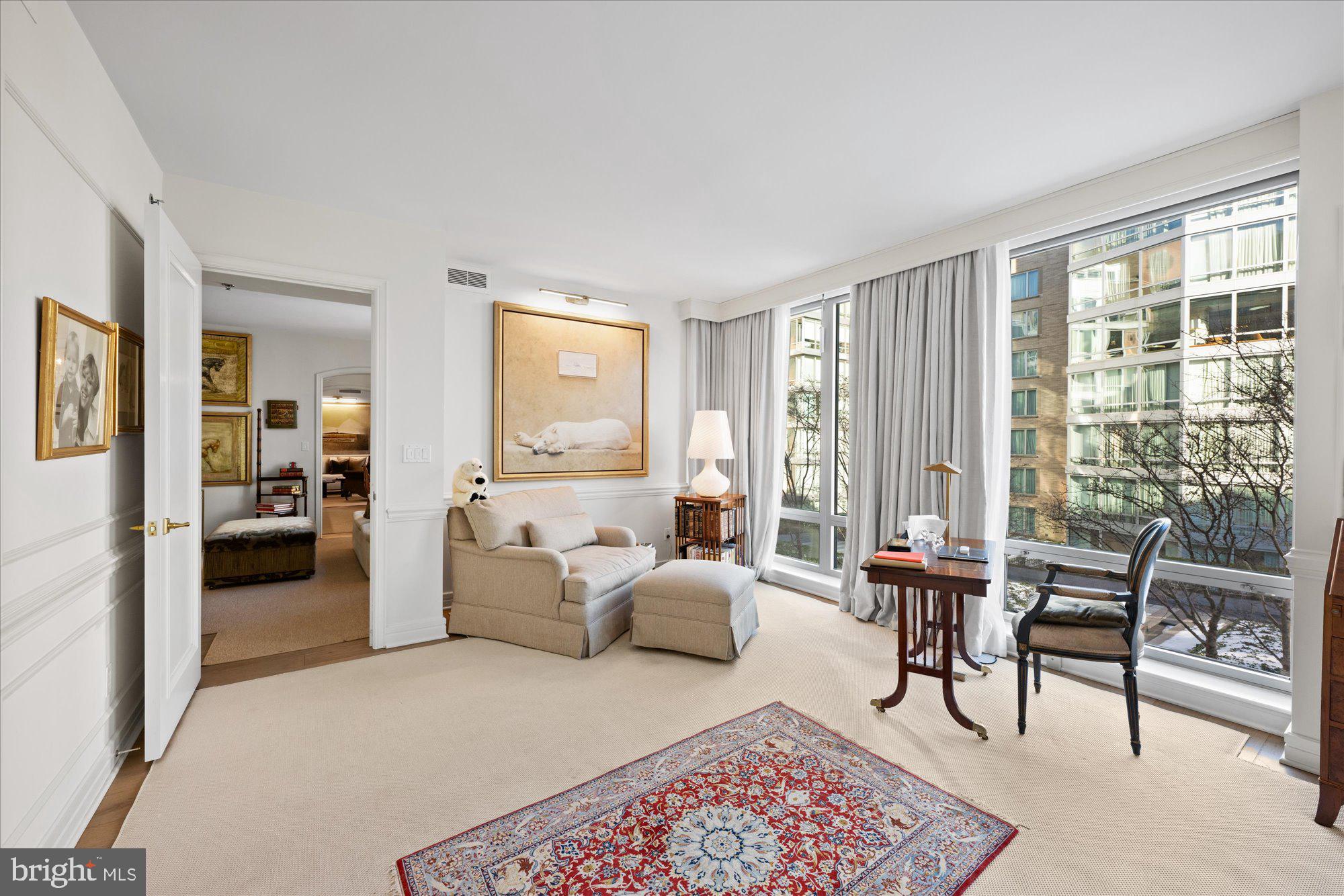 1155 23rd Street Northwest, Unit 7G Washington, DC 20037 - Photo 20 of 38 a living room with furniture and a large window