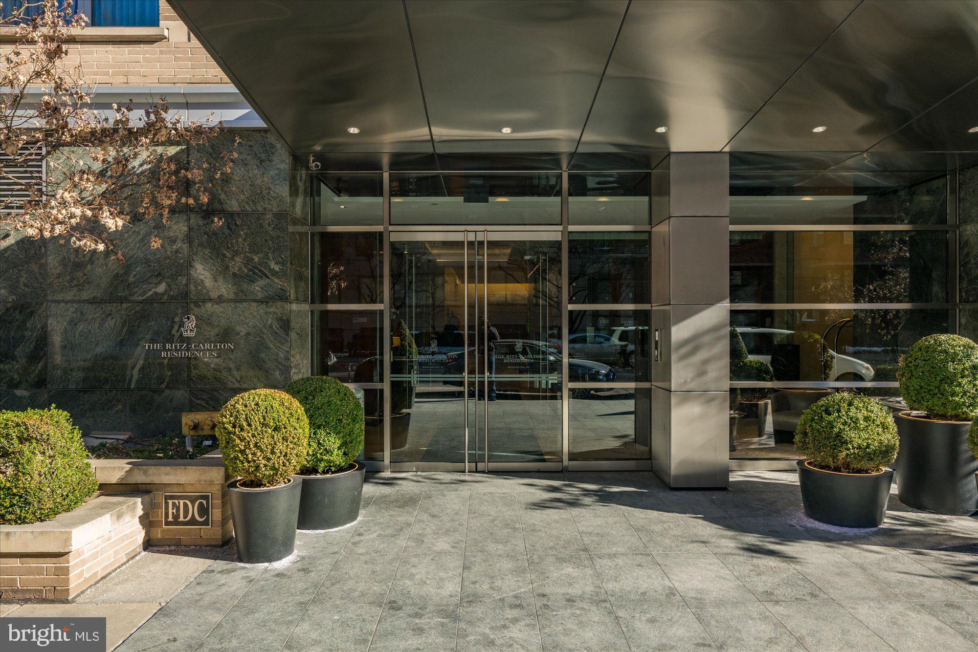 1155 23rd Street Northwest, Unit 7G Washington, DC 20037 - Photo 2 of 38 a view of a garden with potted plants
