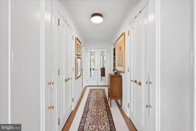 a view of a hallway with a livingroom and a hallway