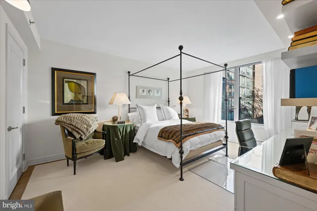 a bedroom with bed and window