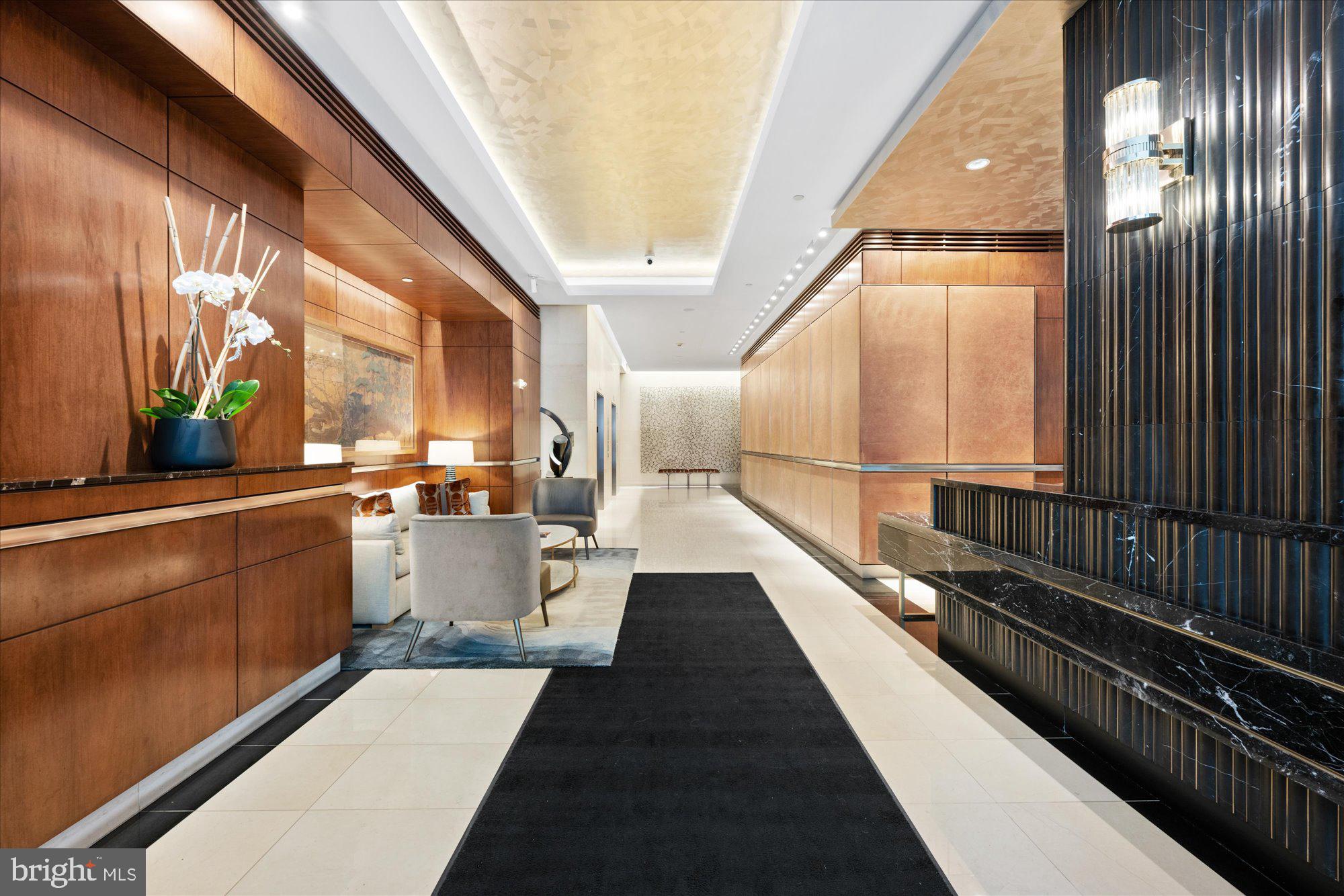 1155 23rd Street Northwest, Unit 7G Washington, DC 20037 - Photo 3 of 38 a view of a balcony with lots of potted plants