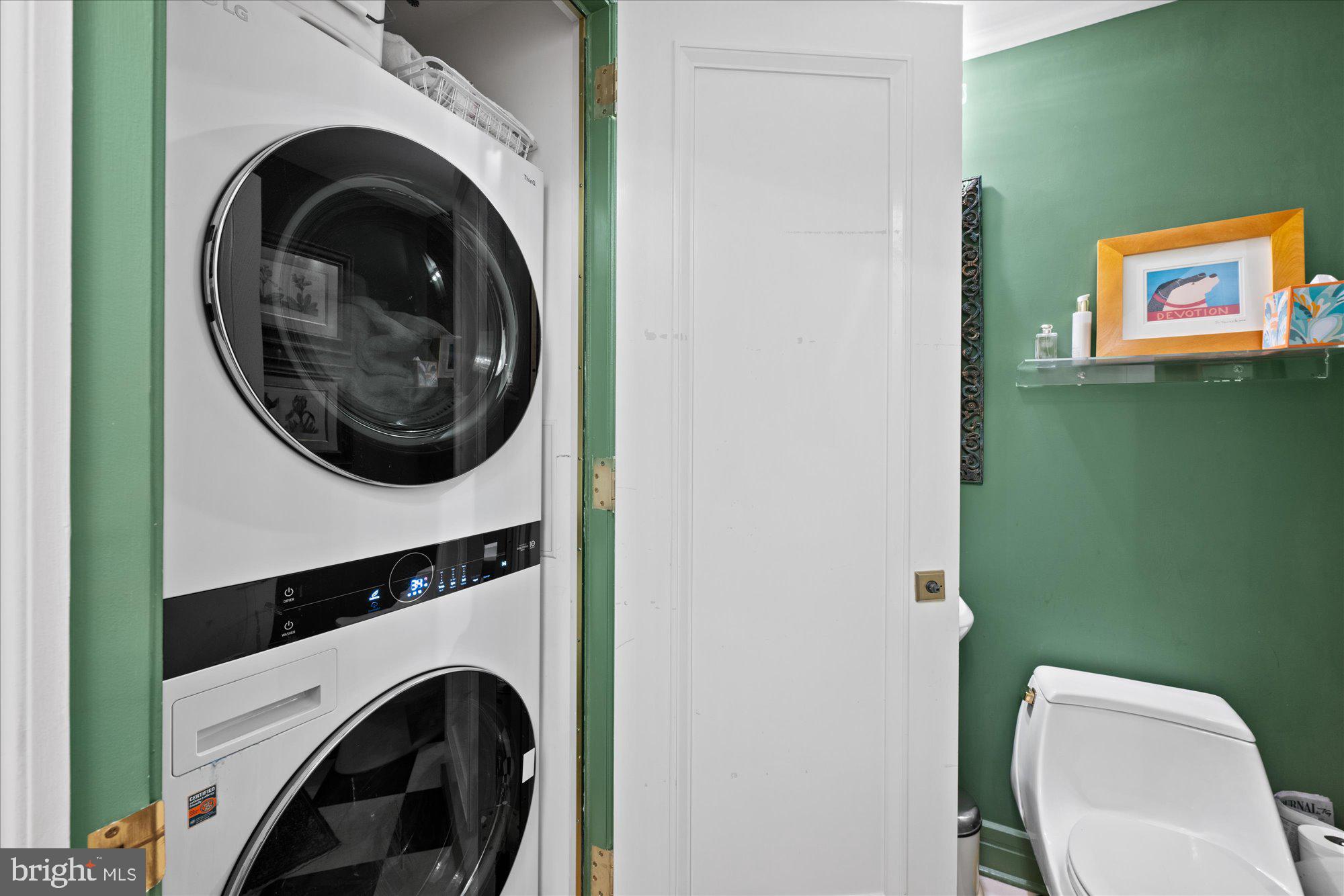 1155 23rd Street Northwest, Unit 7G Washington, DC 20037 - Photo 32 of 38 a view of a hallway with washer and dryer