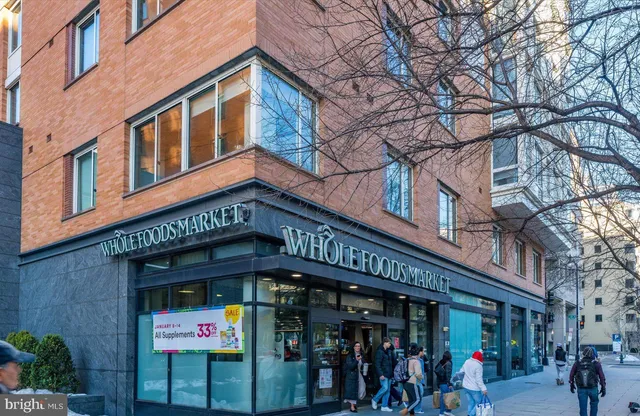 a view of a building with retail shops