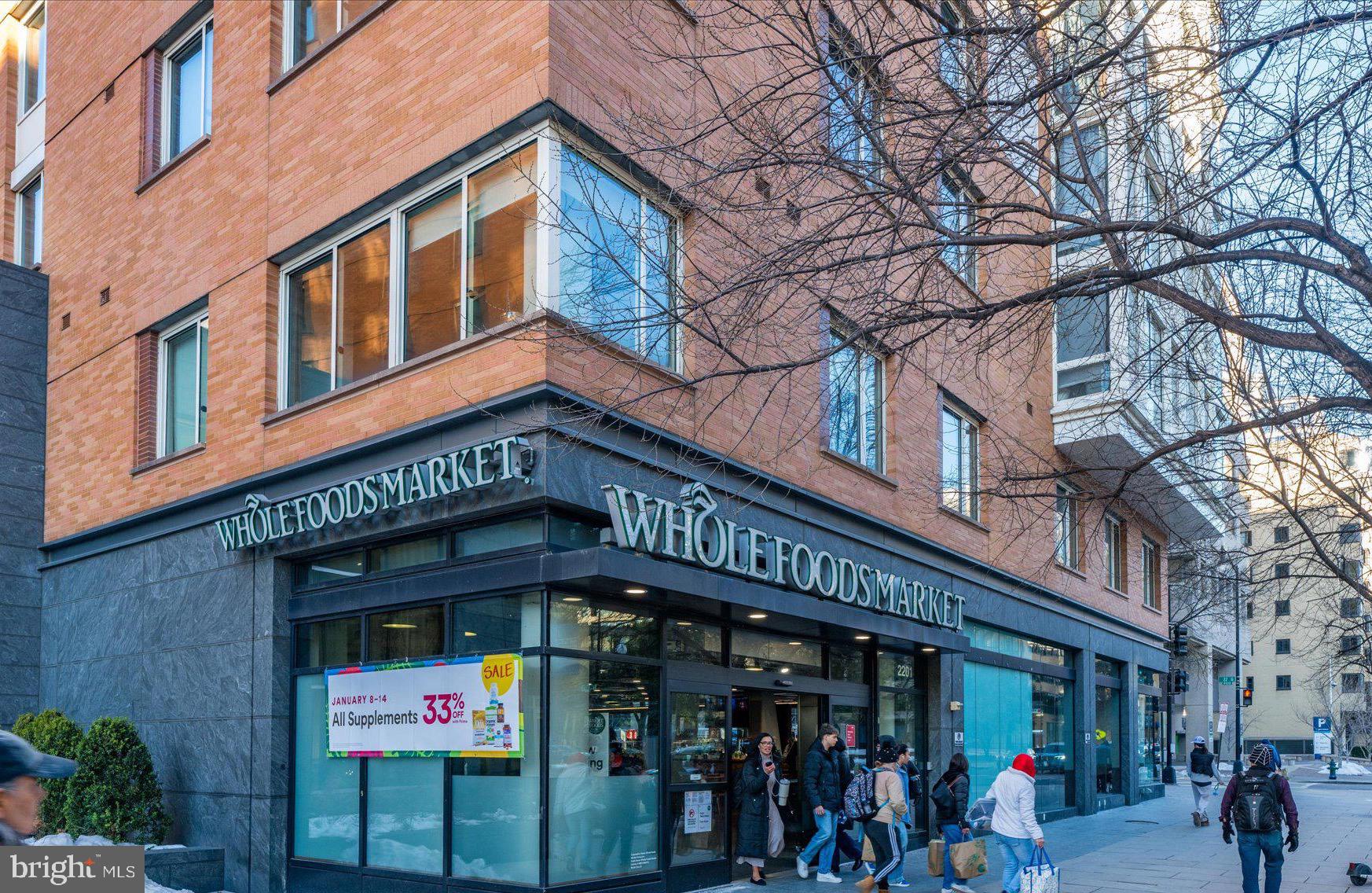 1155 23rd Street Northwest, Unit 7G Washington, DC 20037 - Photo 36 of 38 a view of a building with retail shops