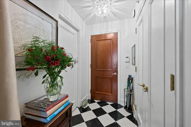 a room with furniture and a potted plant