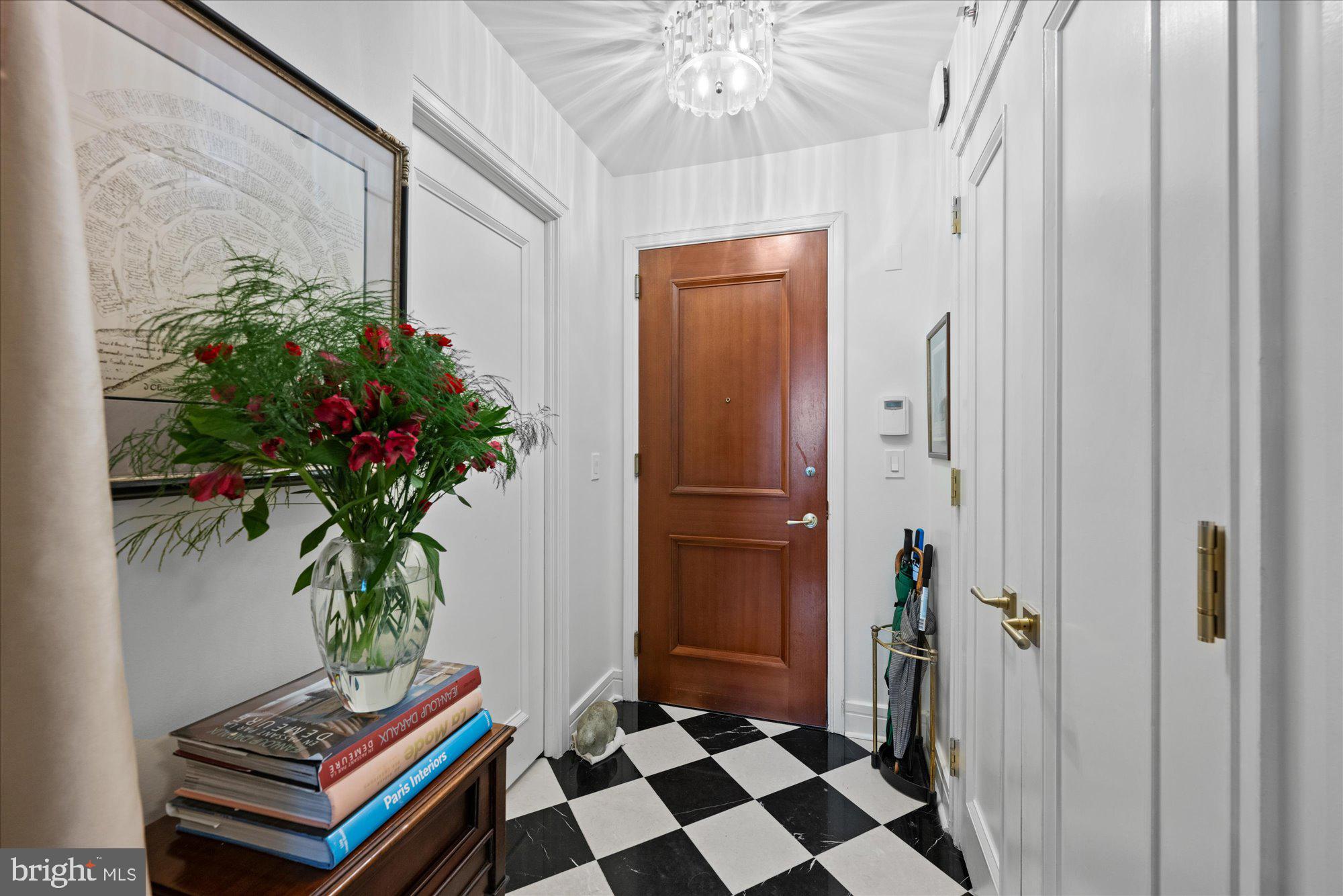 1155 23rd Street Northwest, Unit 7G Washington, DC 20037 - Photo 5 of 38 a room with furniture and a potted plant