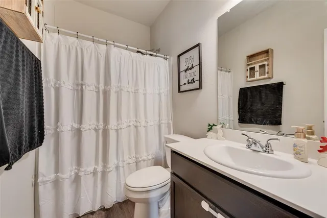 a bedroom with a bed and a book shelf