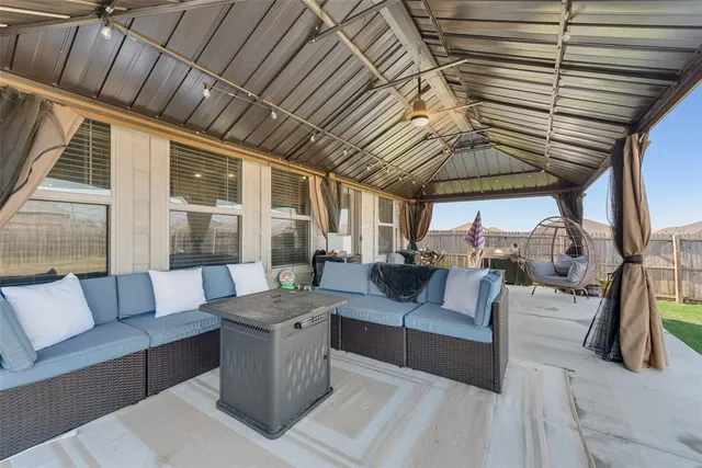 a bedroom with furniture and a window